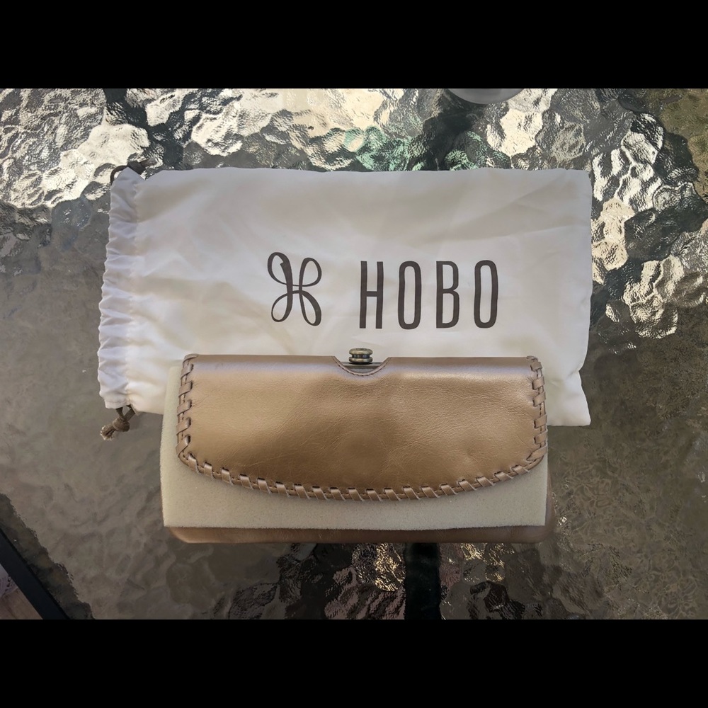 Hobo foldable wallet in light gold shimmer color. Dust bag included.